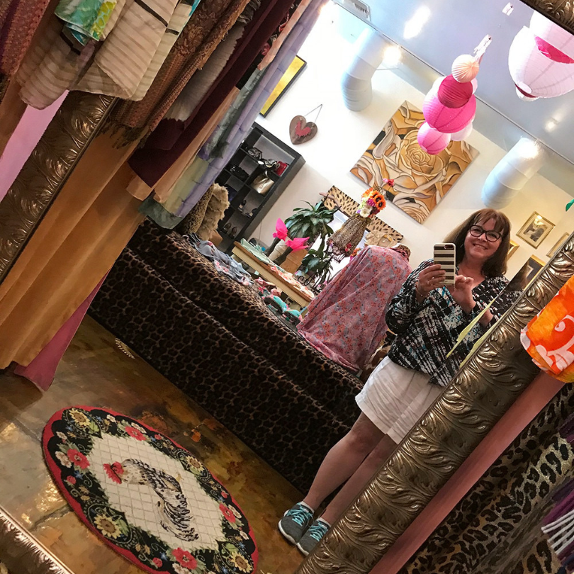 woman looking at herself in mirror