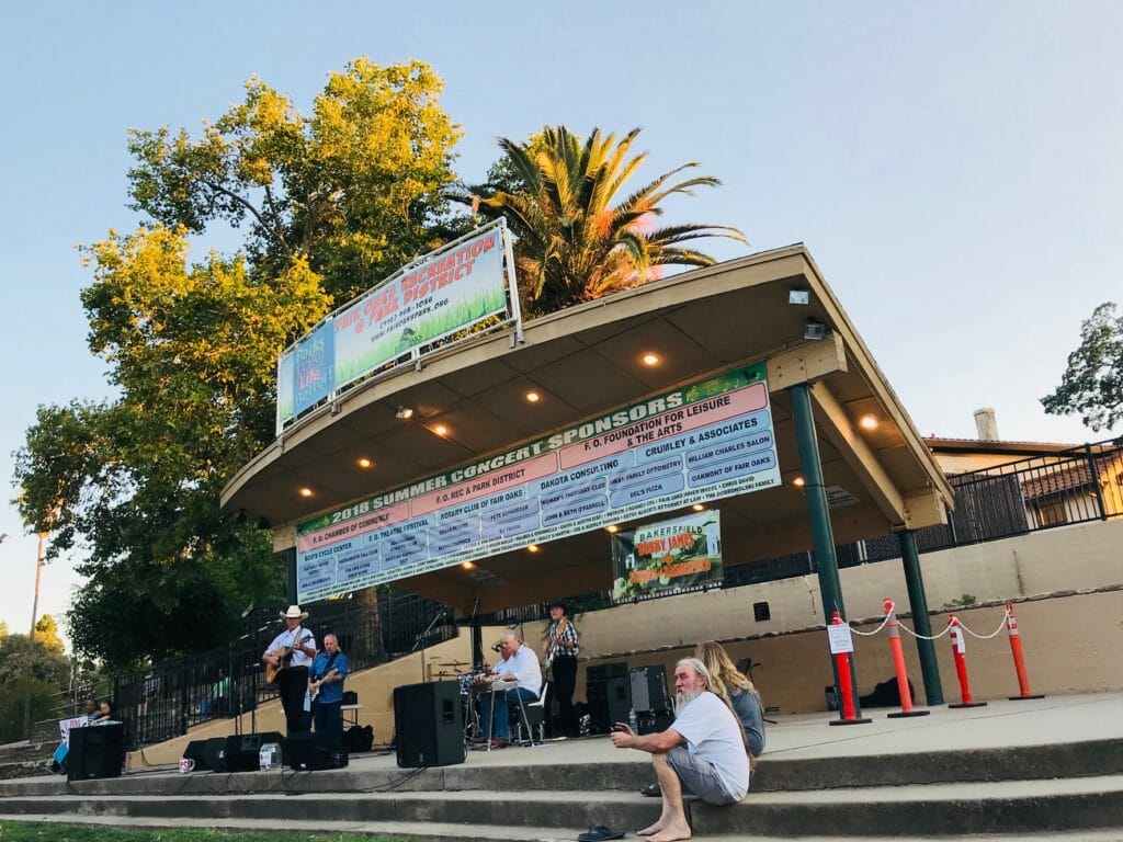 Robby James and the streets of Bakersfield band on stage at concerts in the park fair oaks california