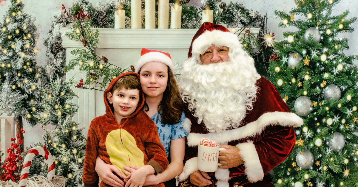santa in front of fireplace with children