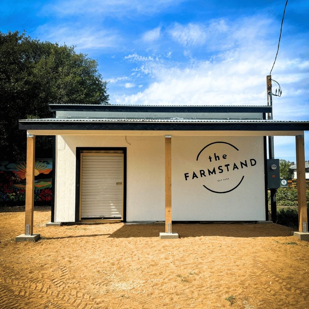 pictured a small building structure for a fruit stand