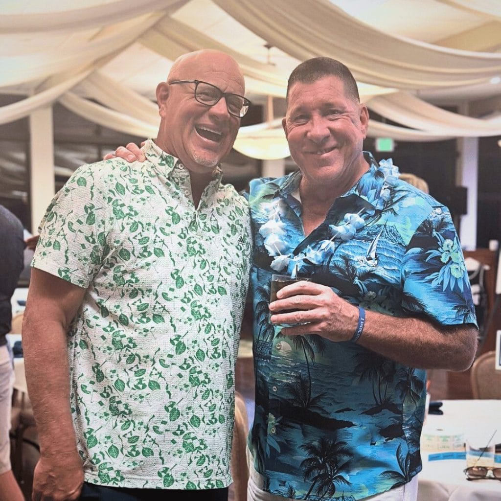 two men in hawaiian shirts