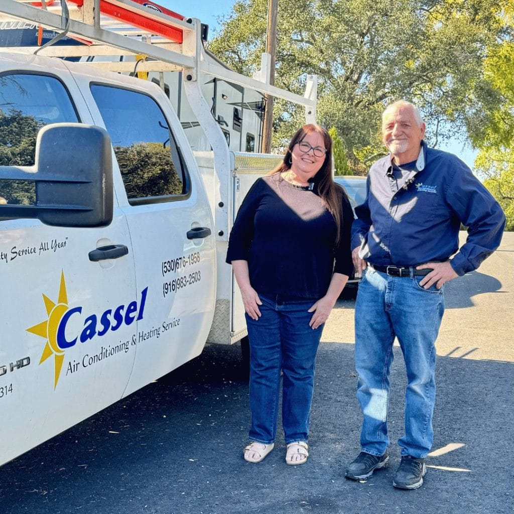 woman and man standing next to pickup