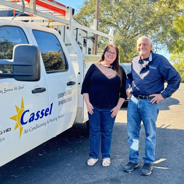 woman and man standing next to pickup