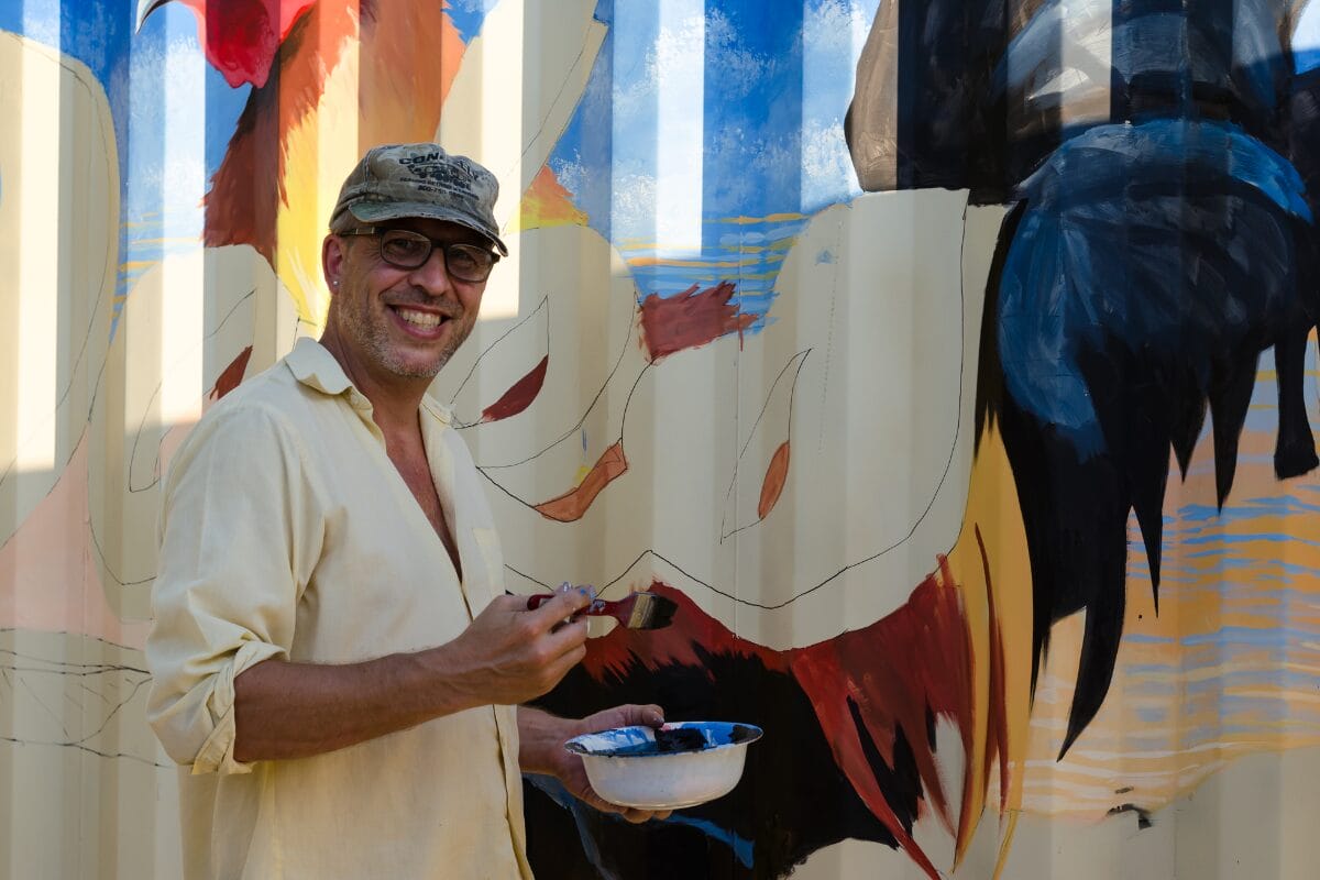 artist michael painting his famous rooster mural at dads kitchen in fair oaks california