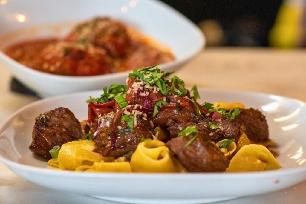 permanent: creamy pappardelle made with ají amarillo, a Peruvian pepper, topped with lomo saltado-style steak bites and finished with an oyster glaze. bodega biondi fair oaks village