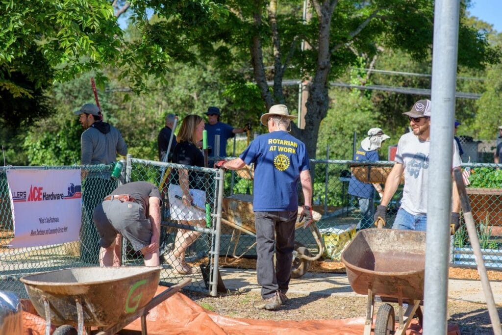 rotary club of fair oaks members working in garden for infinite friends